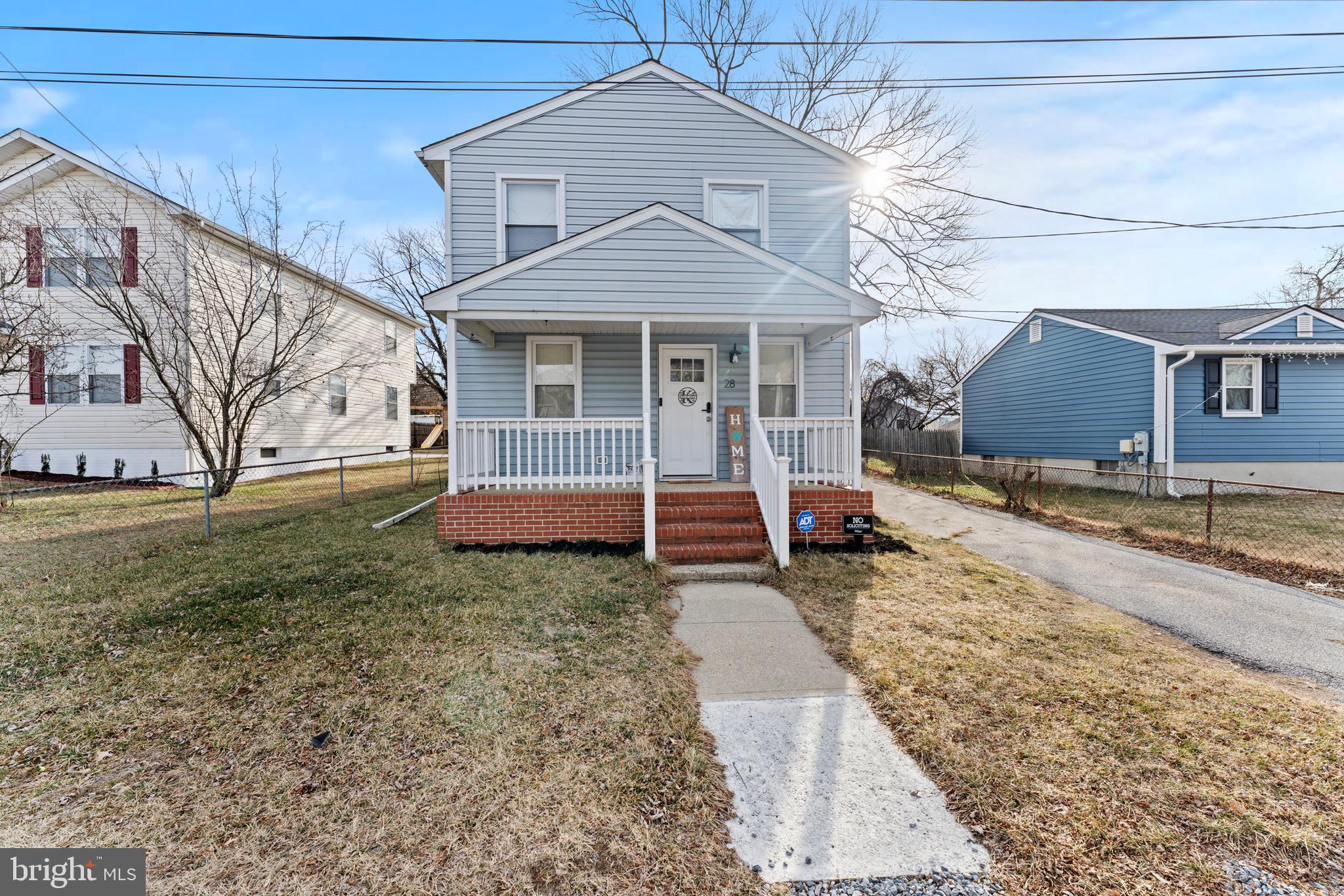 28 Queen Anne Road Glen Burnie, MD 21060 - Photo 1 of 47 a front view of a house with garden