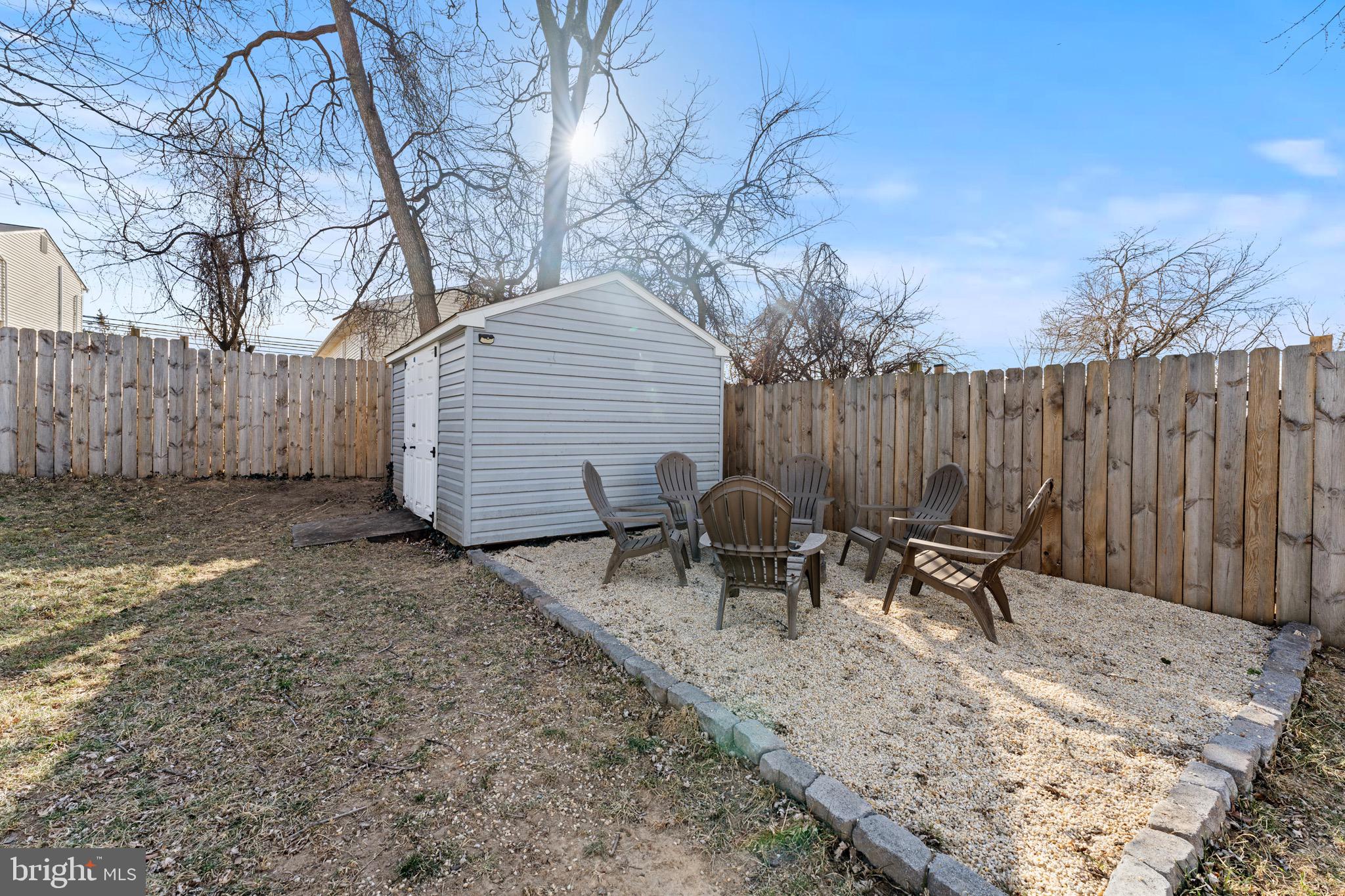28 Queen Anne Road Glen Burnie, MD 21060 - Photo 28 of 47 a backyard of a house with table and chairs