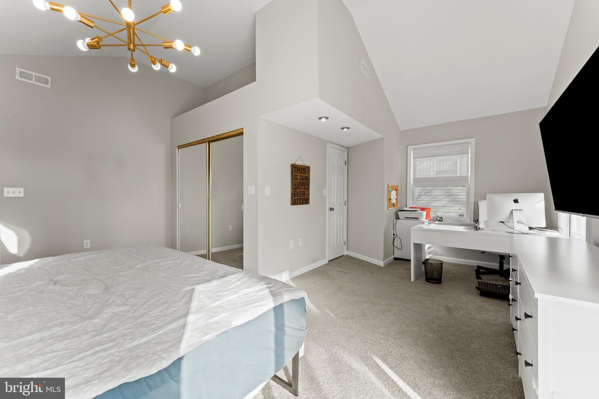 28 Queen Anne Road Glen Burnie, MD 21060 - Photo 35 of 47 a bedroom with a bed and a flat screen tv