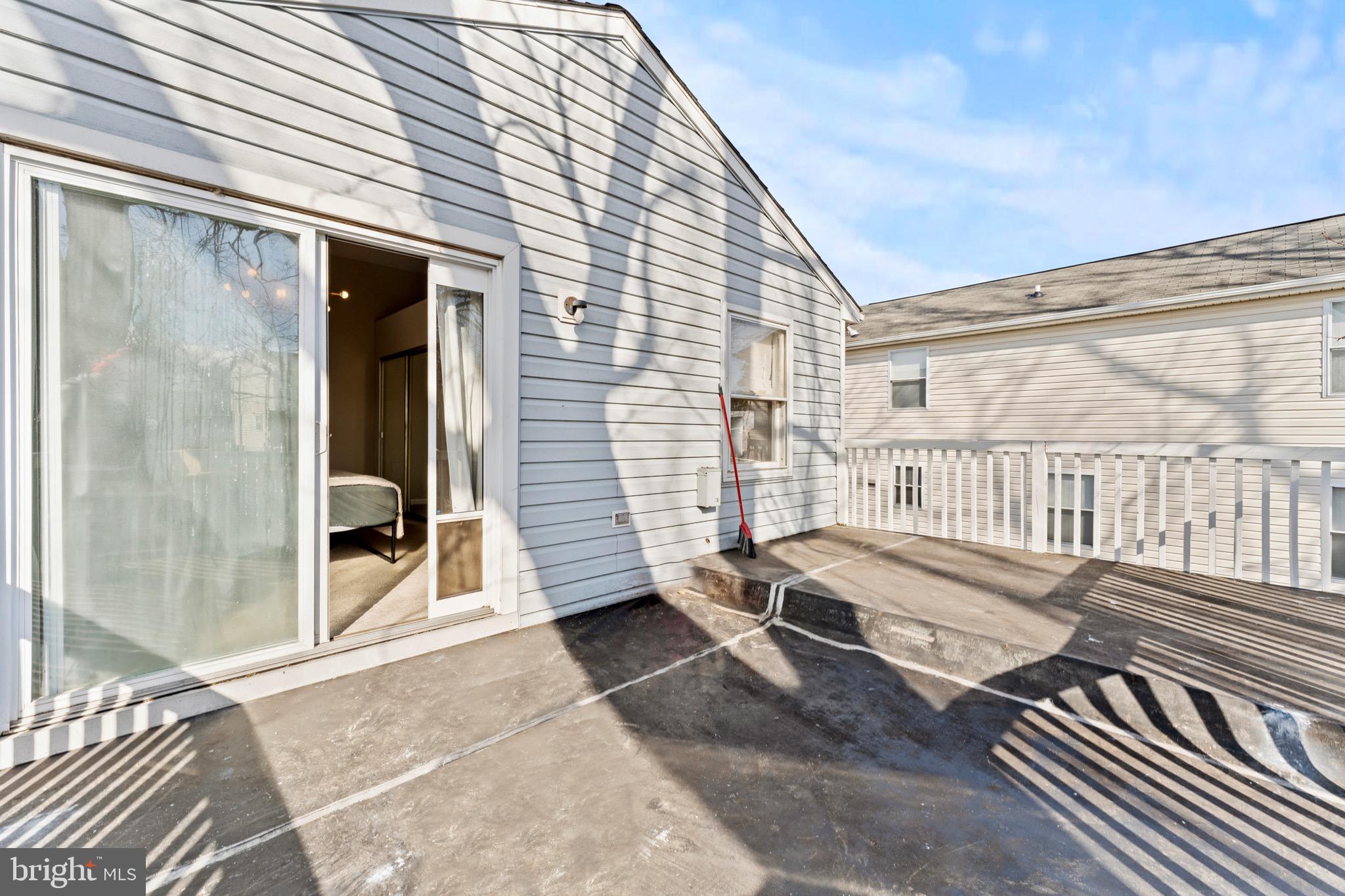 28 Queen Anne Road Glen Burnie, MD 21060 - Photo 39 of 47 a view of a patio with wooden floor and iron stairs