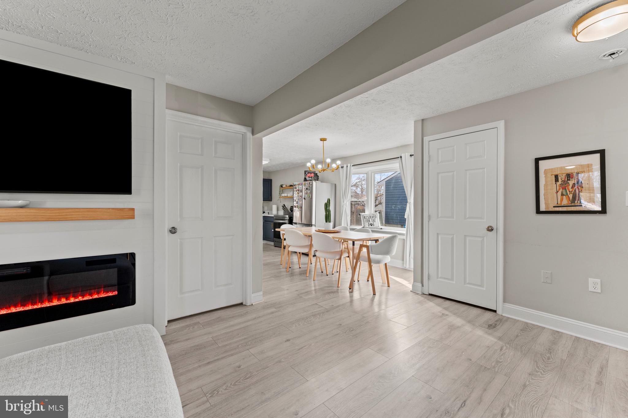 28 Queen Anne Road Glen Burnie, MD 21060 - Photo 6 of 47 a view of a livingroom with furniture and a flat screen tv
