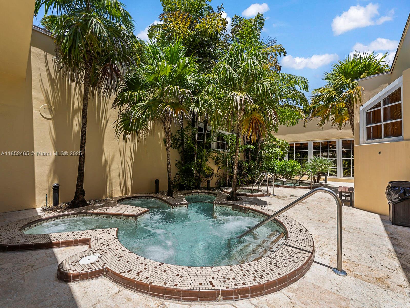 1000 Quayside Terrace, Unit 706 Miami, FL 33138 - Photo 29 of 33 a view of a swimming pool with sitting area