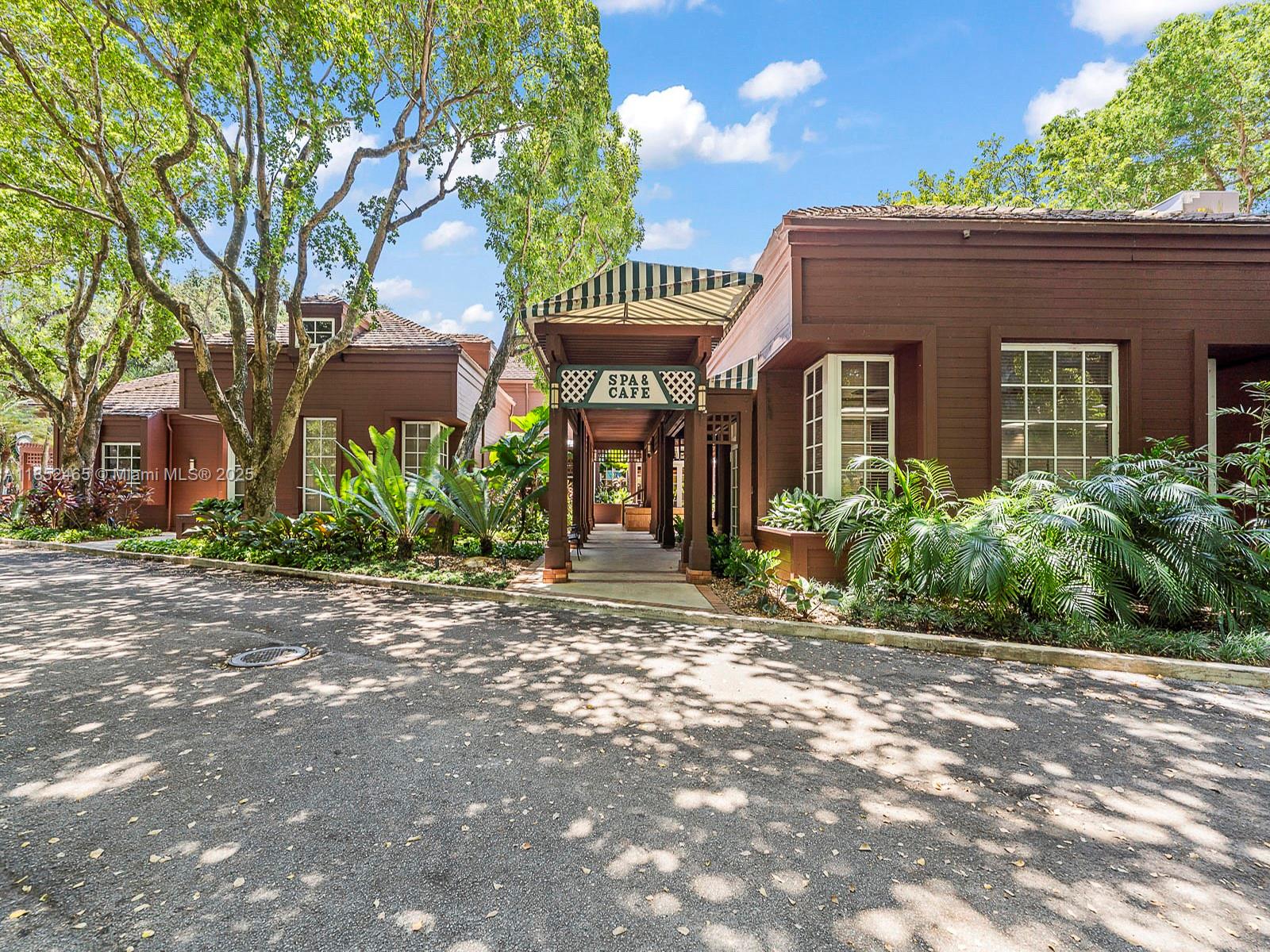 1000 Quayside Terrace, Unit 706 Miami, FL 33138 - Photo 31 of 33 a front view of a house with garden