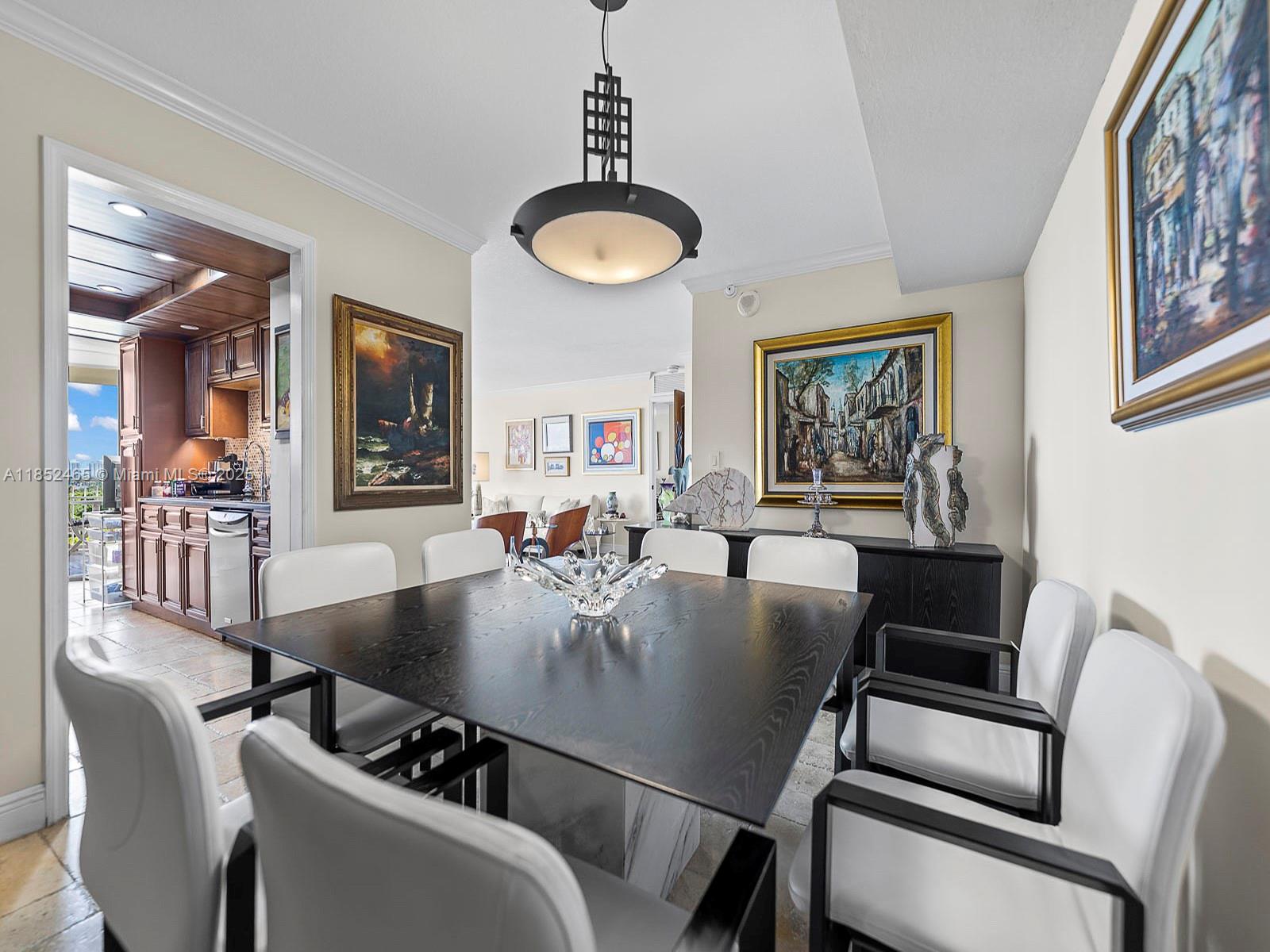 1000 Quayside Terrace, Unit 706 Miami, FL 33138 - Photo 7 of 33 a view of a dining room with furniture and chandelier