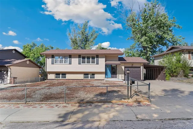 a house with a bench in front of it