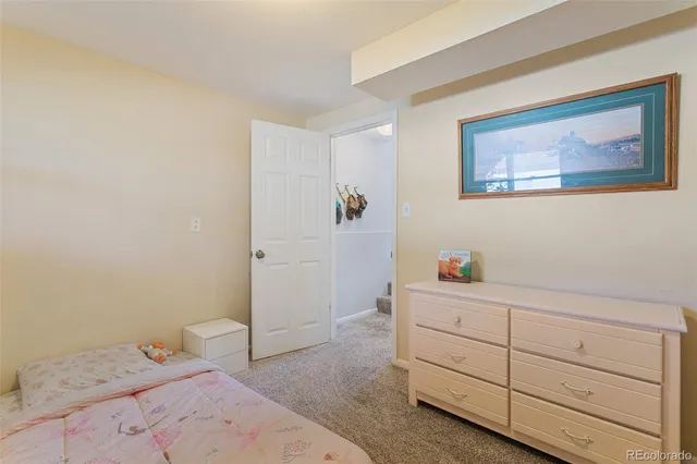 a bedroom with a bed and a cabinets