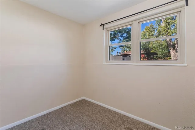 a view of a livingroom with wooden floor