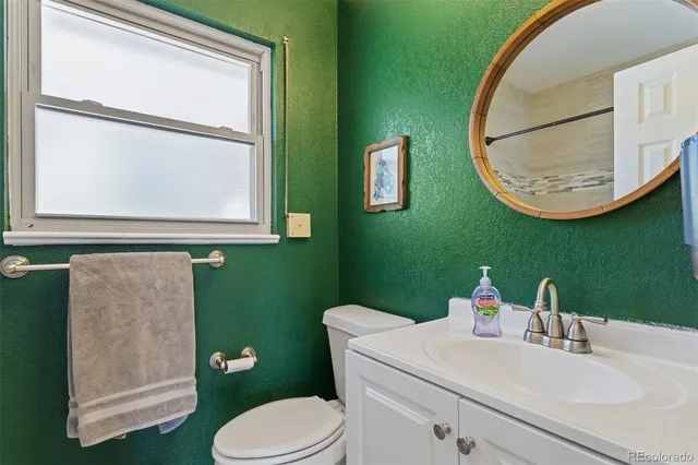 a view of porch with a table and chairs