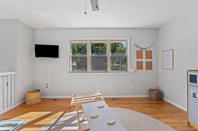 a bedroom with a bed and flat screen tv