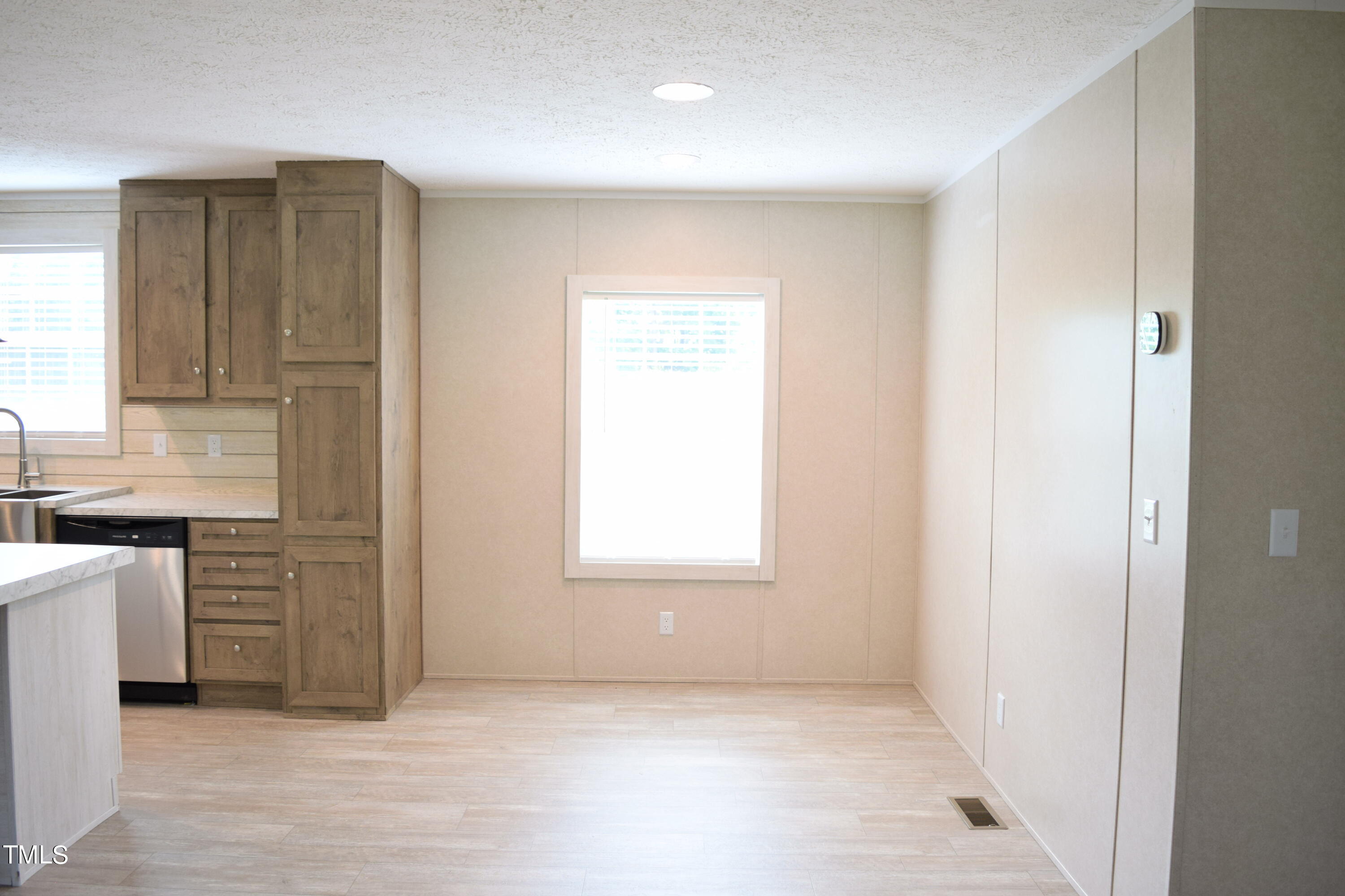 4370 Needham Road Bailey, NC 27807 - Photo 12 of 41 a view of a kitchen with a sink and dishwasher cabinets