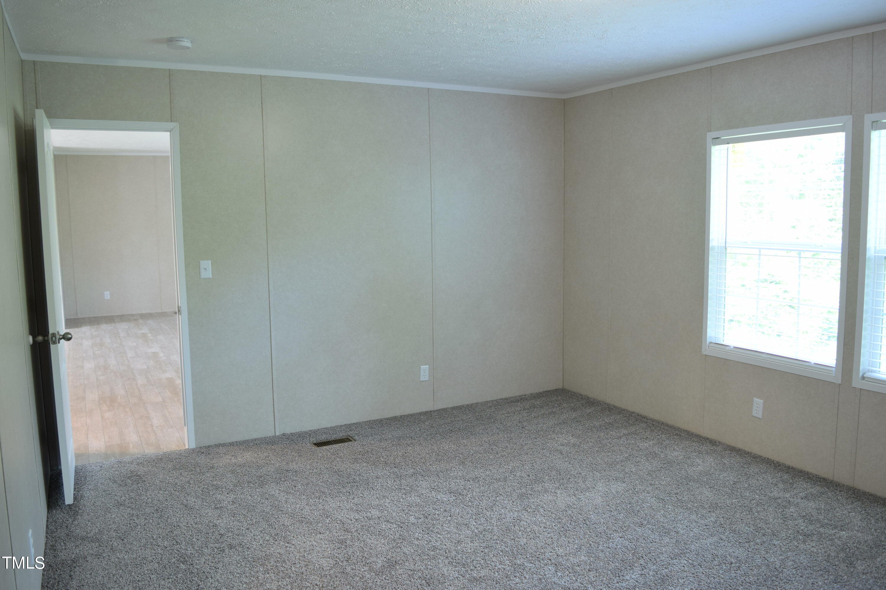 4370 Needham Road Bailey, NC 27807 - Photo 14 of 41 an empty room with a window