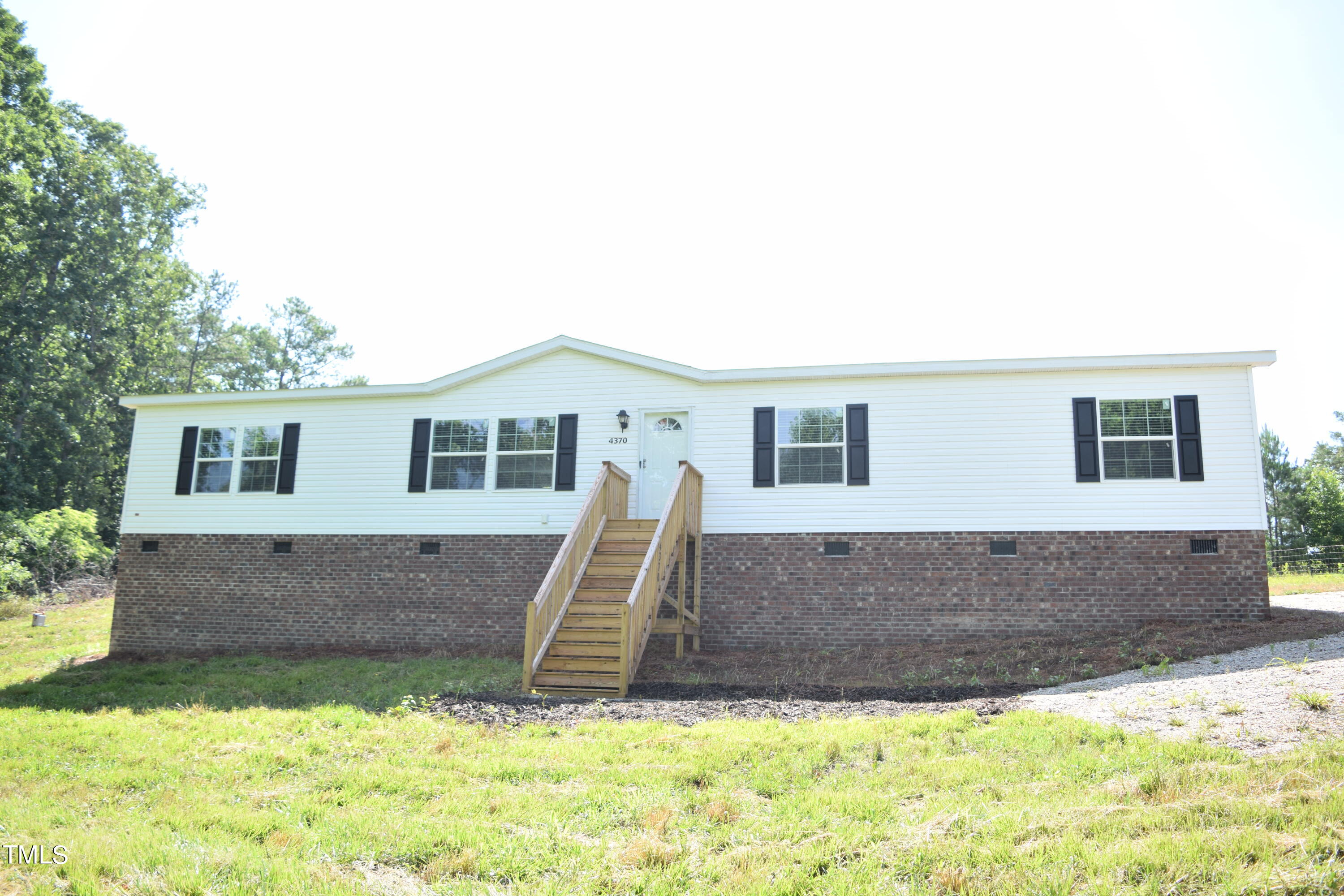 4370 Needham Road Bailey, NC 27807 - Photo 2 of 41 a view of a house with a yard