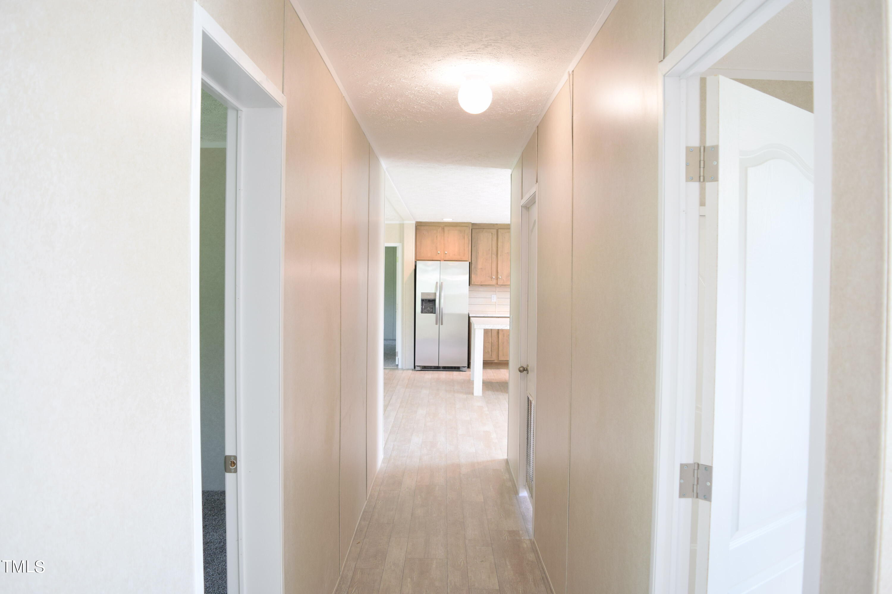 4370 Needham Road Bailey, NC 27807 - Photo 23 of 41 a view of a hallway with wooden floor