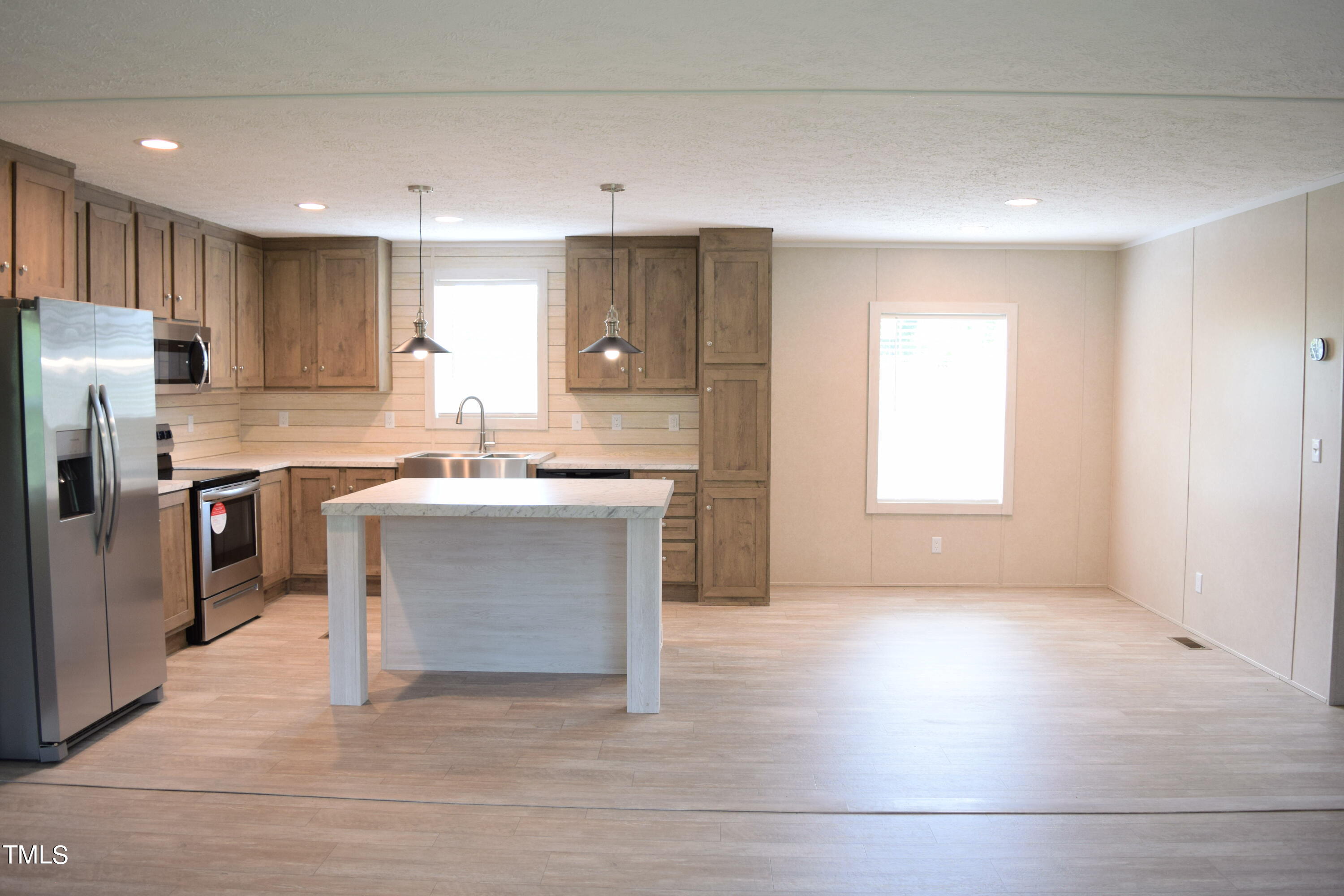 4370 Needham Road Bailey, NC 27807 - Photo 5 of 41 a view living room with a sink and chandelier