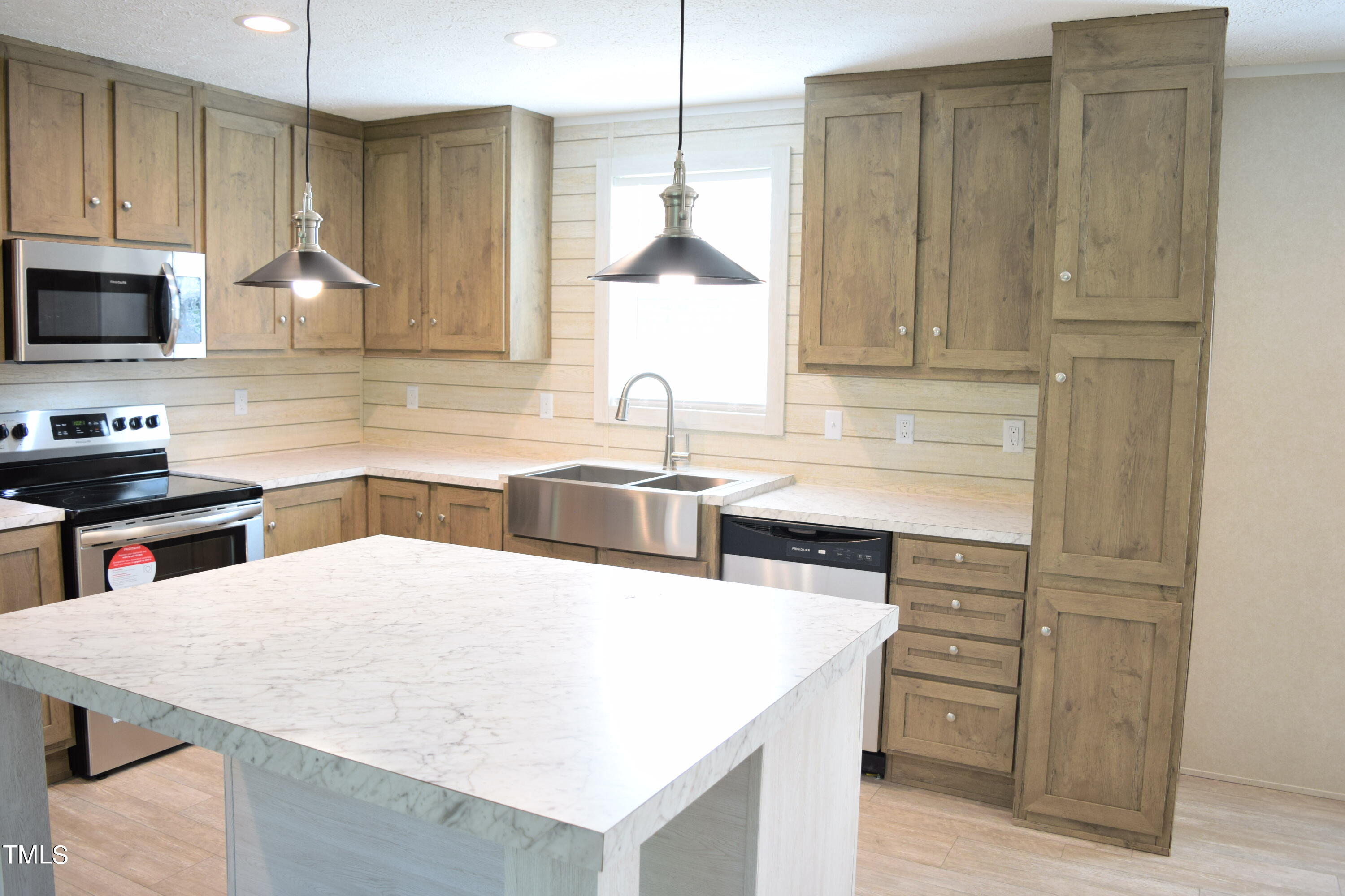 4370 Needham Road Bailey, NC 27807 - Photo 7 of 41 a kitchen with stainless steel appliances granite countertop a sink a stove and a microwave oven