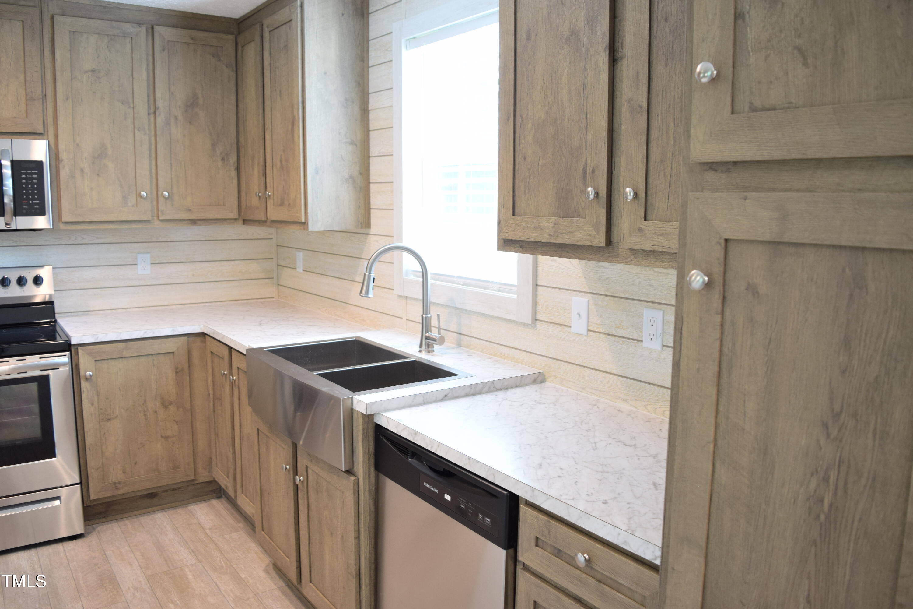 4370 Needham Road Bailey, NC 27807 - Photo 8 of 41 a kitchen with a sink cabinets and appliances
