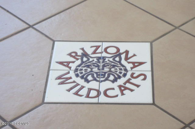 555 Row Court Rio Rico, AZ 85648 - Photo 6 of 25 a sign that is on the wall