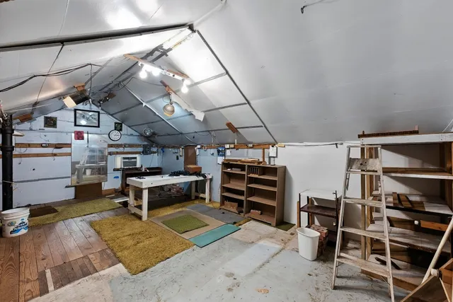 an aerial view of multiple houses with yard