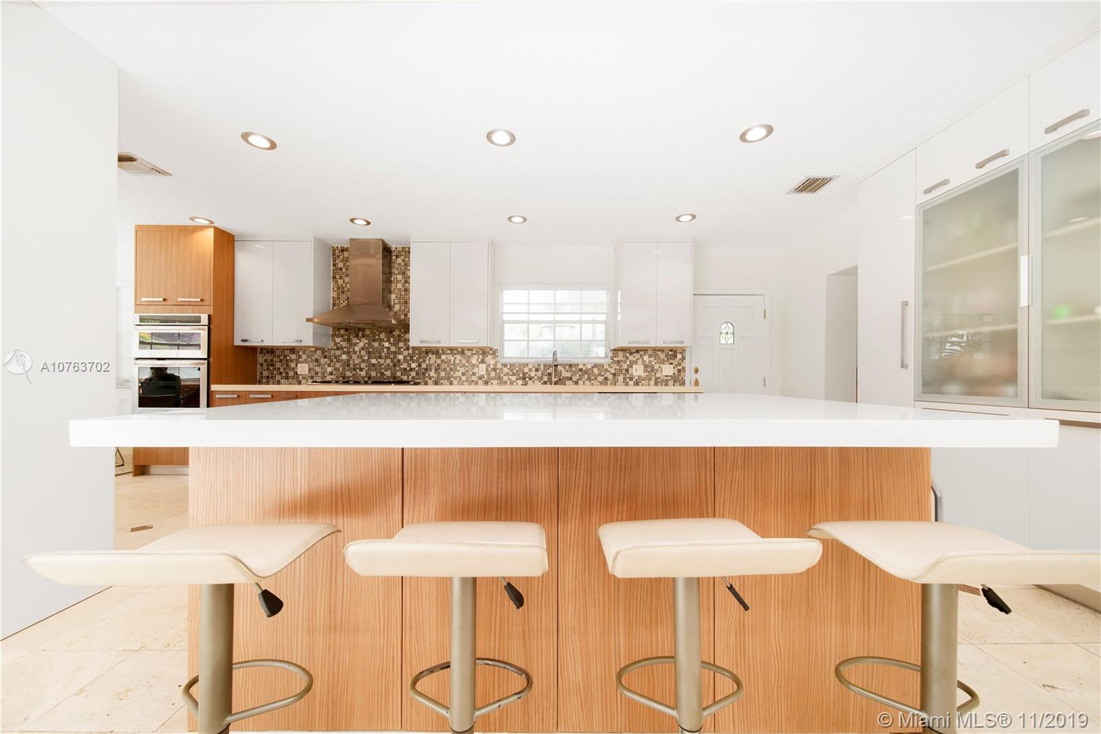 244 Southwest 28th Road Miami, FL 33129 - Photo 12 of 43 a view of kitchen with stainless steel appliances kitchen island