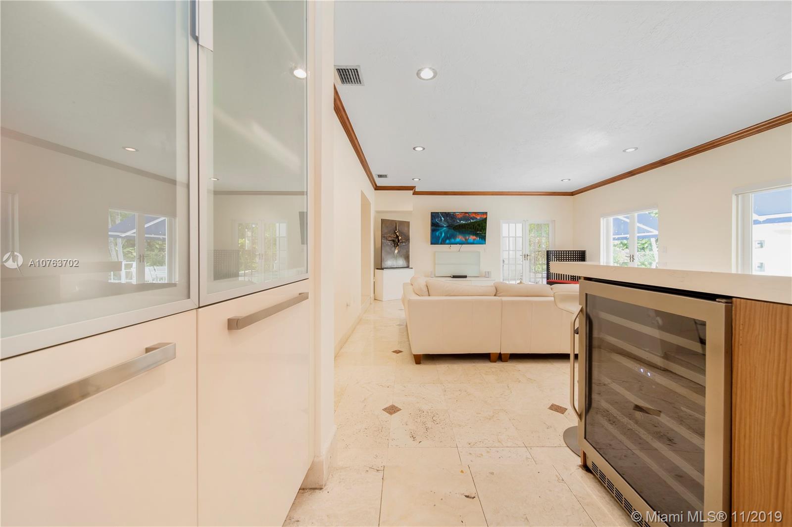 244 Southwest 28th Road Miami, FL 33129 - Photo 18 of 43 a en suite bathroom with a sink and mirror