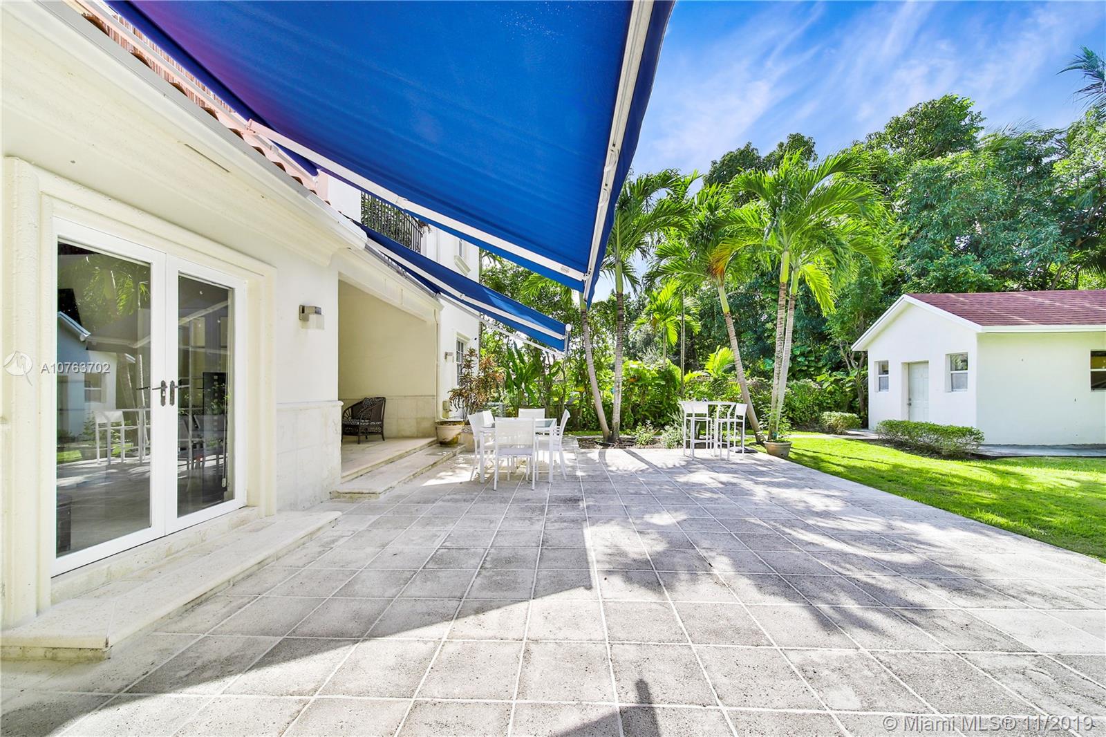 244 Southwest 28th Road Miami, FL 33129 - Photo 23 of 43 a view of a house with a yard and tree s