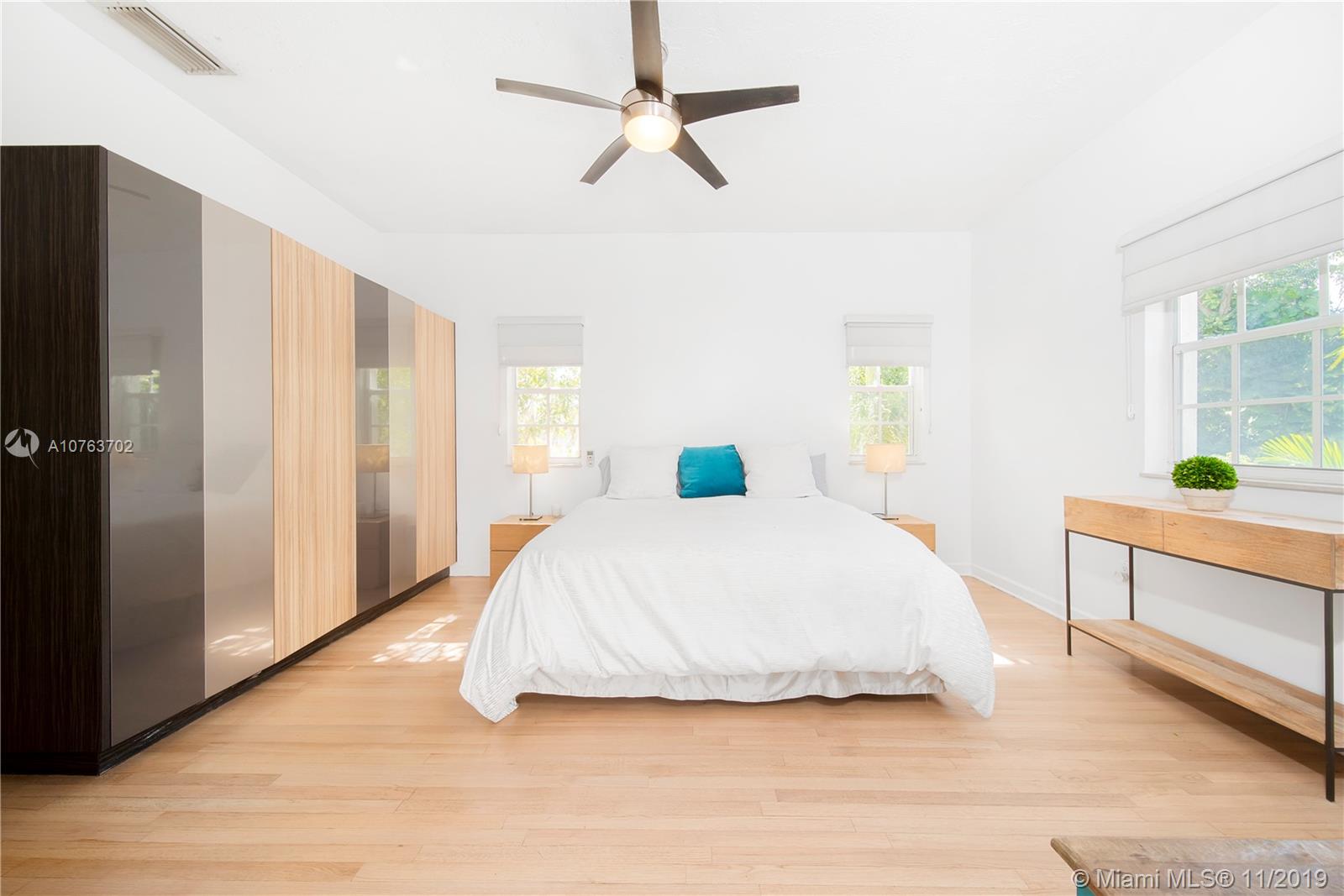 244 Southwest 28th Road Miami, FL 33129 - Photo 31 of 43 a bedroom with a bed and a dresser