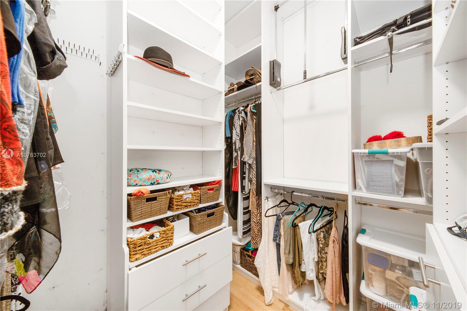 244 Southwest 28th Road Miami, FL 33129 - Photo 33 of 43 a view of walk in closet with clothes and shoes