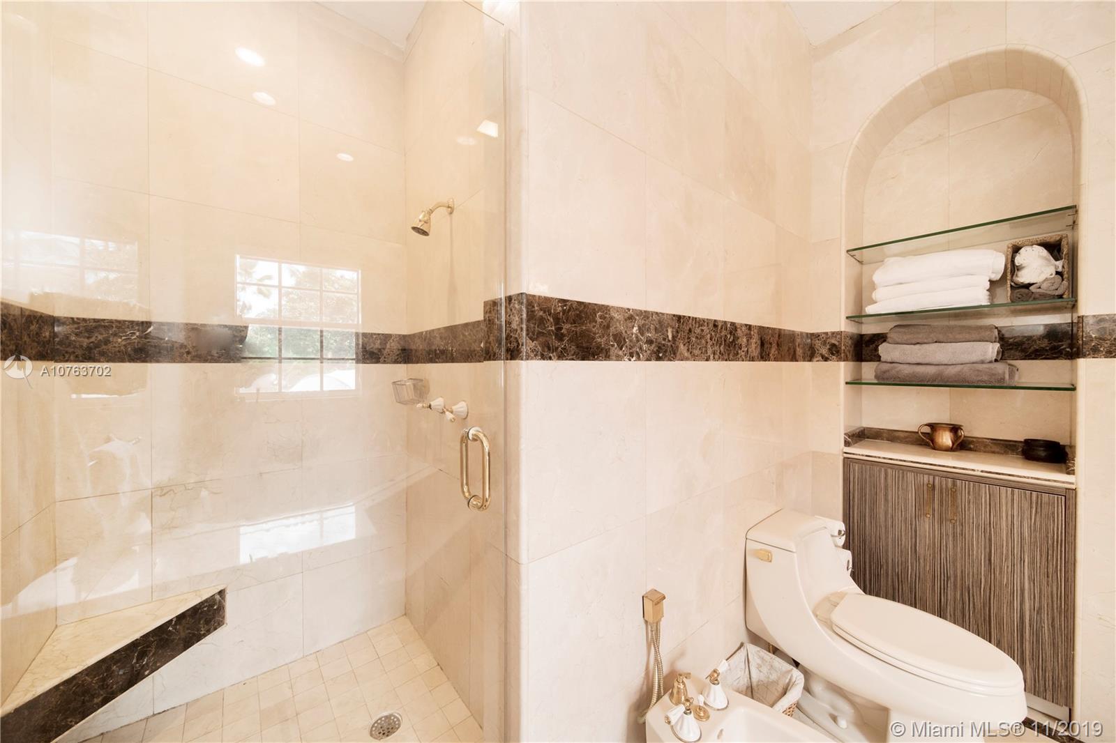 244 Southwest 28th Road Miami, FL 33129 - Photo 36 of 43 a bathroom with a toilet a sink and a shower