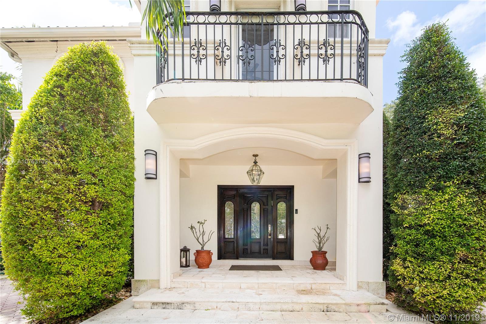 244 Southwest 28th Road Miami, FL 33129 - Photo 4 of 43 a view of a brick house with a large windows