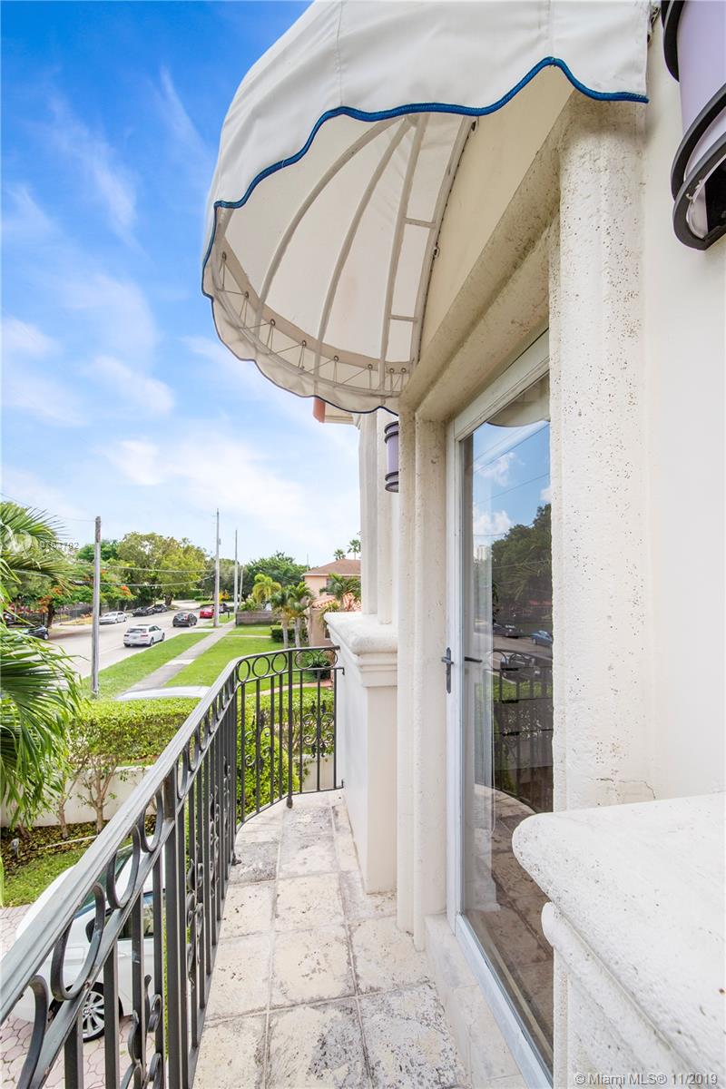 244 Southwest 28th Road Miami, FL 33129 - Photo 41 of 43 a view of a balcony with a swimming pool