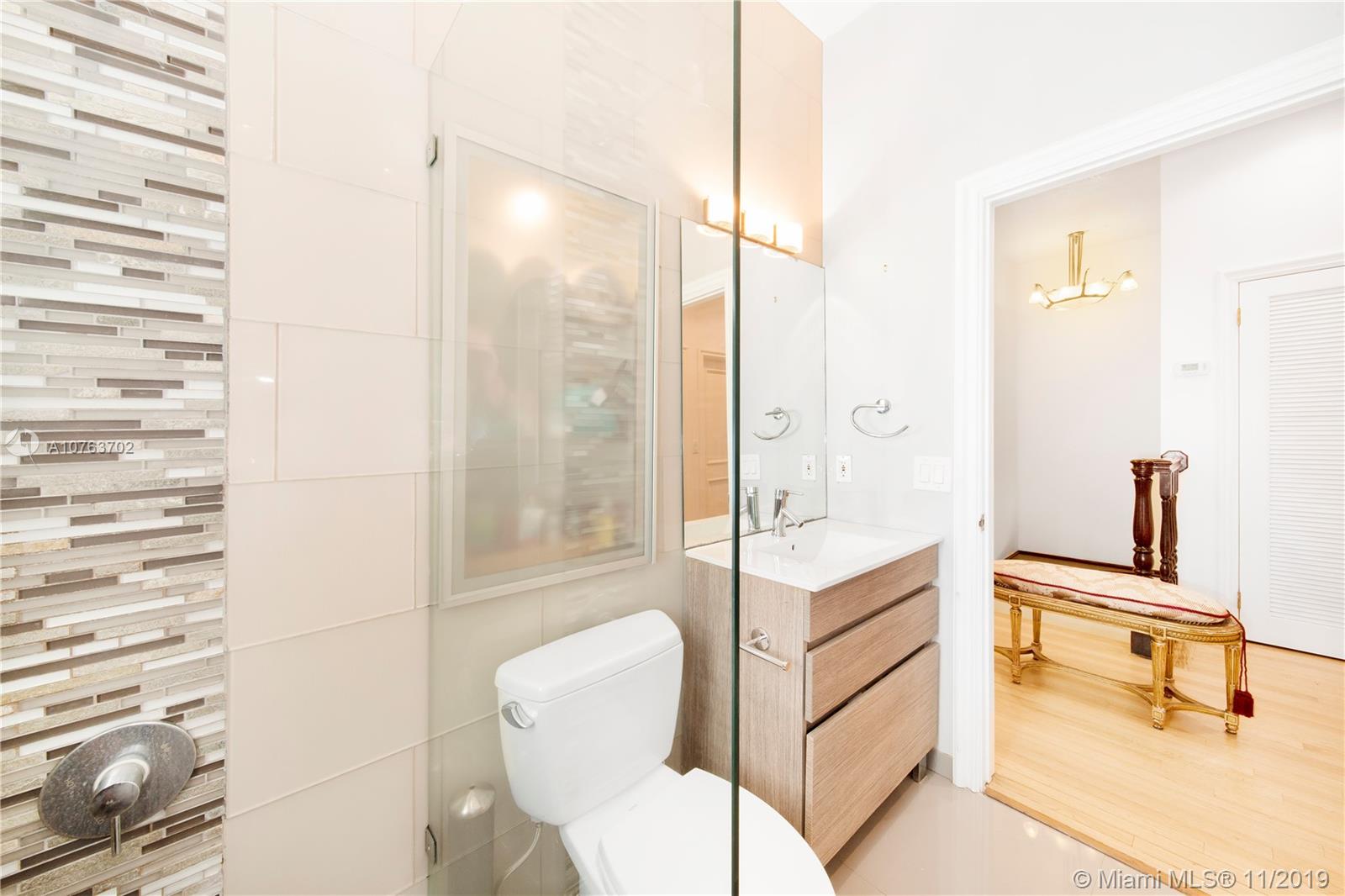 244 Southwest 28th Road Miami, FL 33129 - Photo 43 of 43 a bathroom with a tub and shower