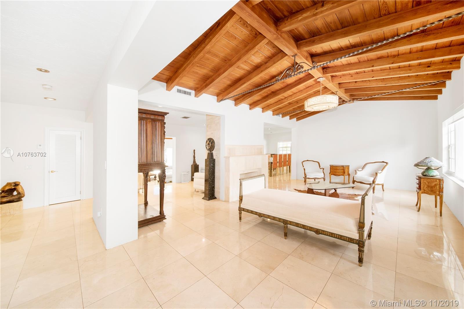 244 Southwest 28th Road Miami, FL 33129 - Photo 8 of 43 a bedroom with furniture and a walk in closet