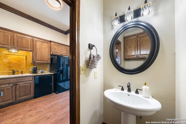 a view of a hallway with livingroom and lots of furniture