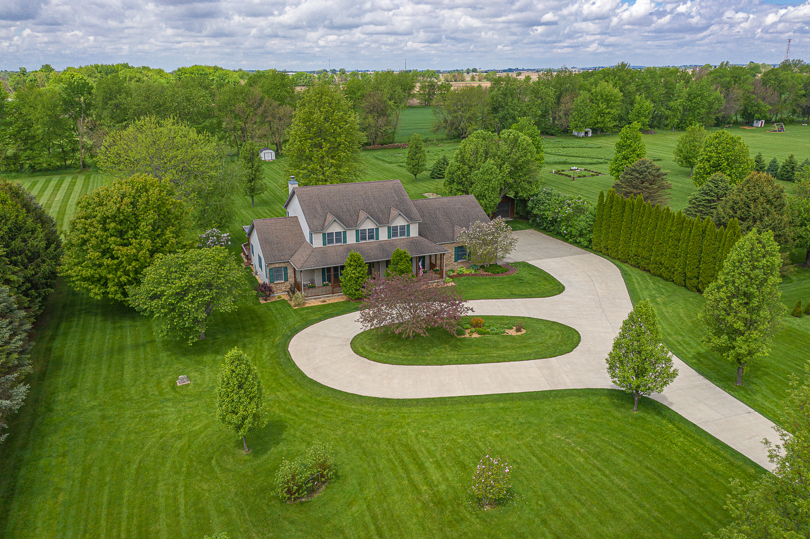 1901 Wildcat Road Dixon, IL 61021 - Photo 2 of 49 a backyard of a house with a yard and outdoor seating