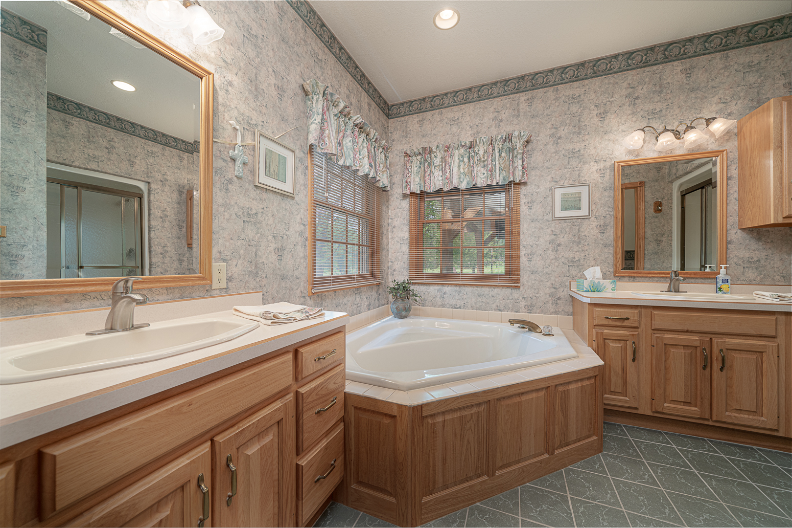 1901 Wildcat Road Dixon, IL 61021 - Photo 17 of 49 a bathroom with a granite countertop sink and a mirror