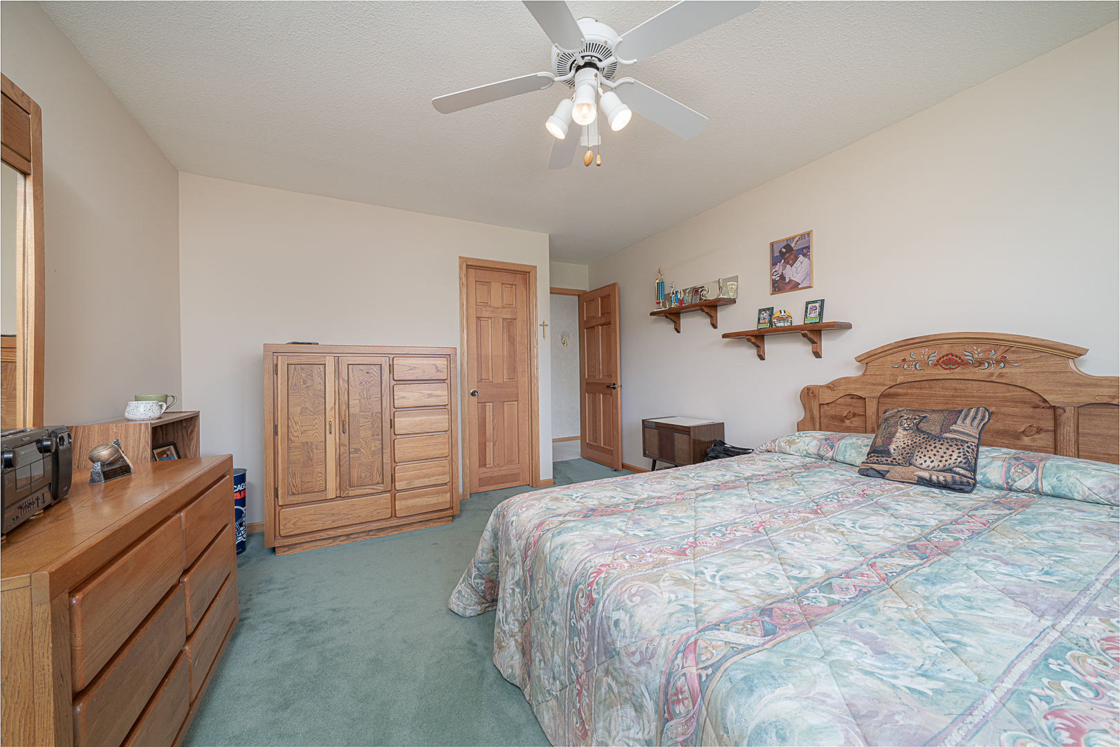 1901 Wildcat Road Dixon, IL 61021 - Photo 21 of 49 a bedroom with a bed and a chandelier