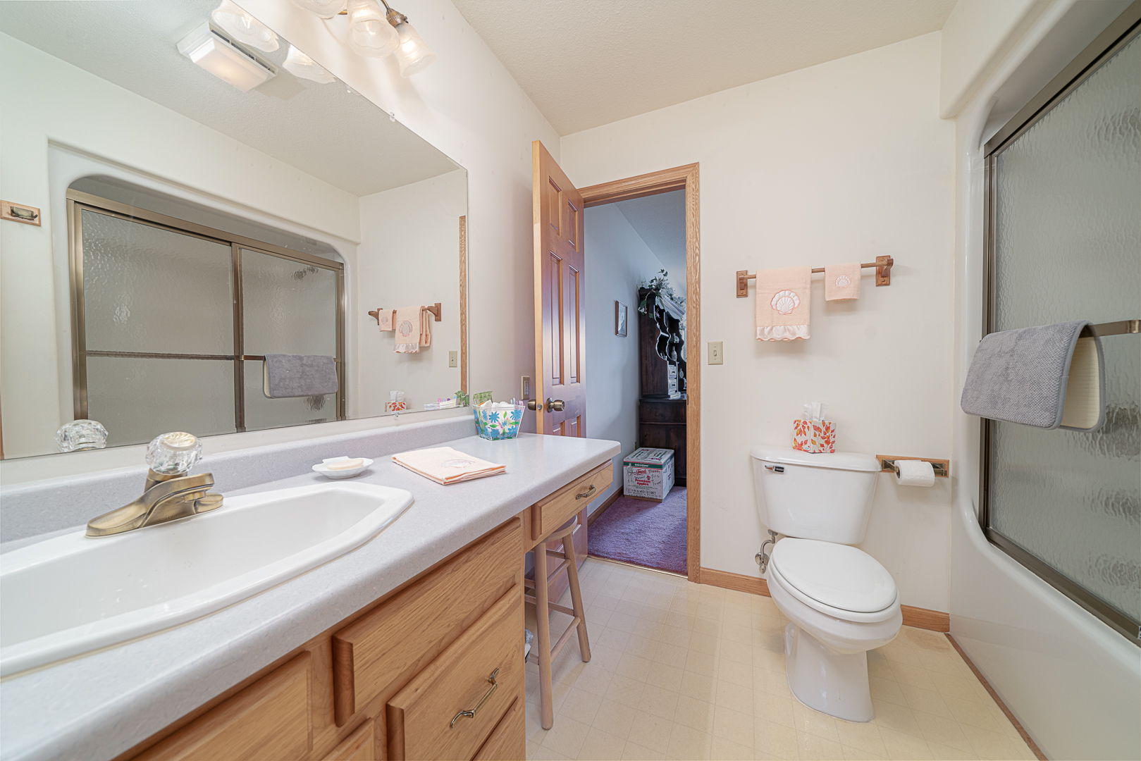 1901 Wildcat Road Dixon, IL 61021 - Photo 27 of 49 a bathroom with a granite countertop sink a toilet and a large mirror