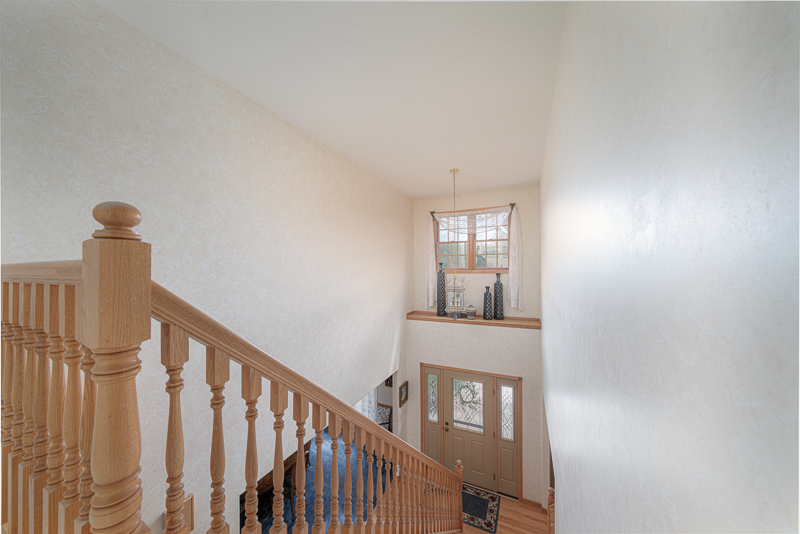 1901 Wildcat Road Dixon, IL 61021 - Photo 30 of 49 a view of staircase with railing and white walls