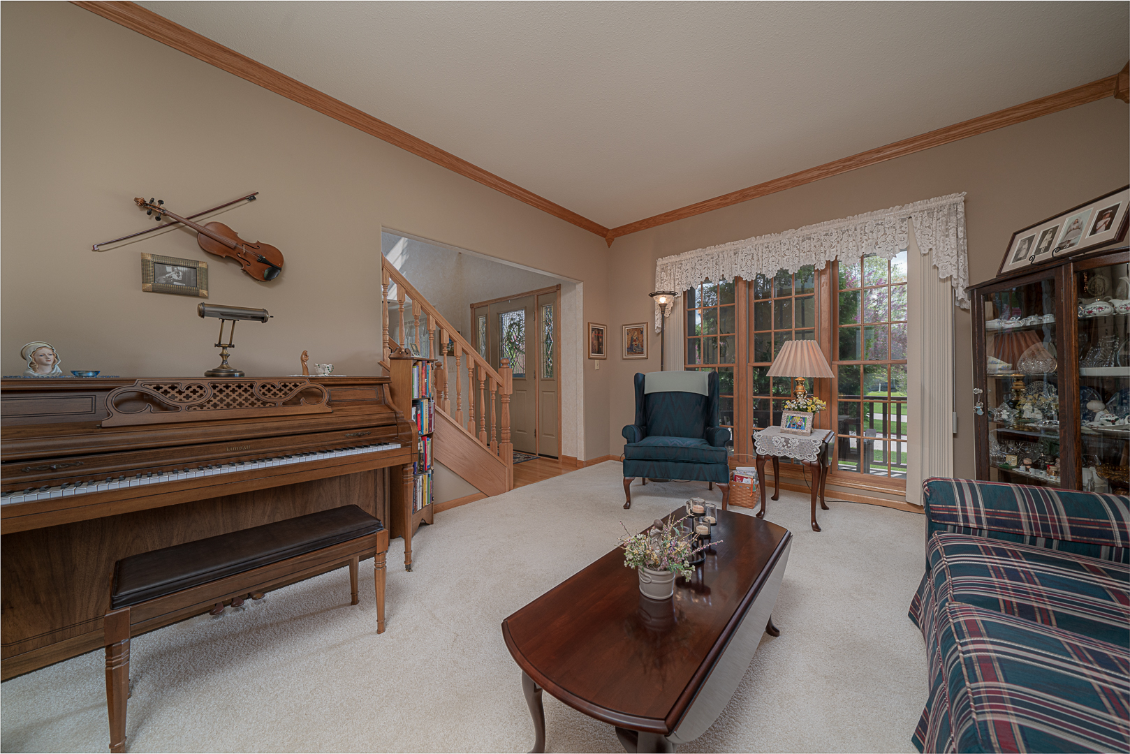 1901 Wildcat Road Dixon, IL 61021 - Photo 5 of 49 a living room with furniture a rug and a chandelier