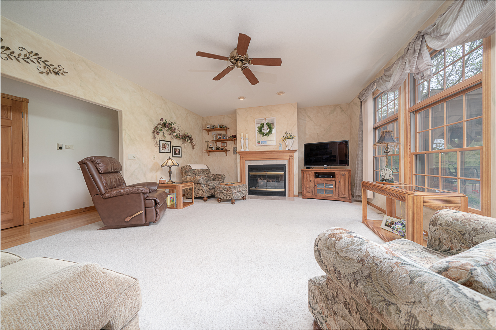 1901 Wildcat Road Dixon, IL 61021 - Photo 8 of 49 a living room with furniture a fireplace and a flat screen tv