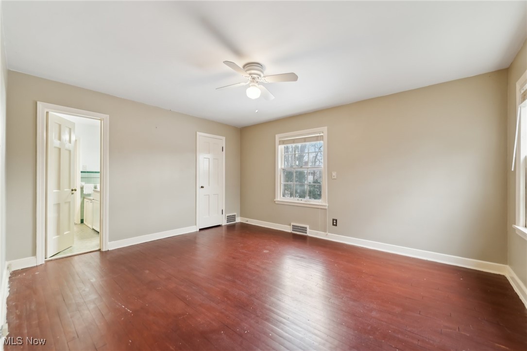 1542 Kew Road Cleveland, OH 44118 - Photo 17 of 23 Empty room featuring dark wood-type flooring and ceiling fan