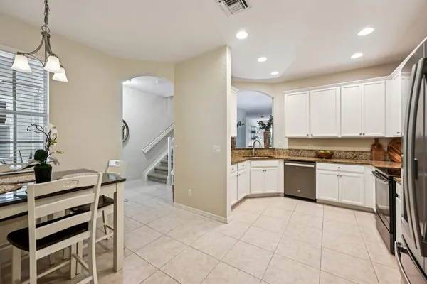 a kitchen with a sink cabinets and window