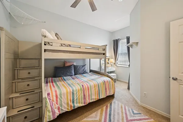 a bedroom with a bed and a dresser