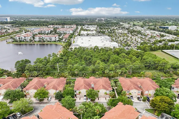 an aerial view of a house with a lake view