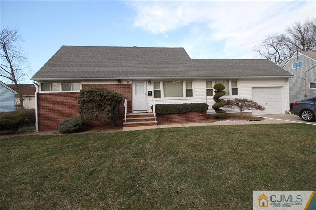 25 Montview Road Edison, NJ 08837 - Photo 1 of 21 a front view of a house with a garden and parking