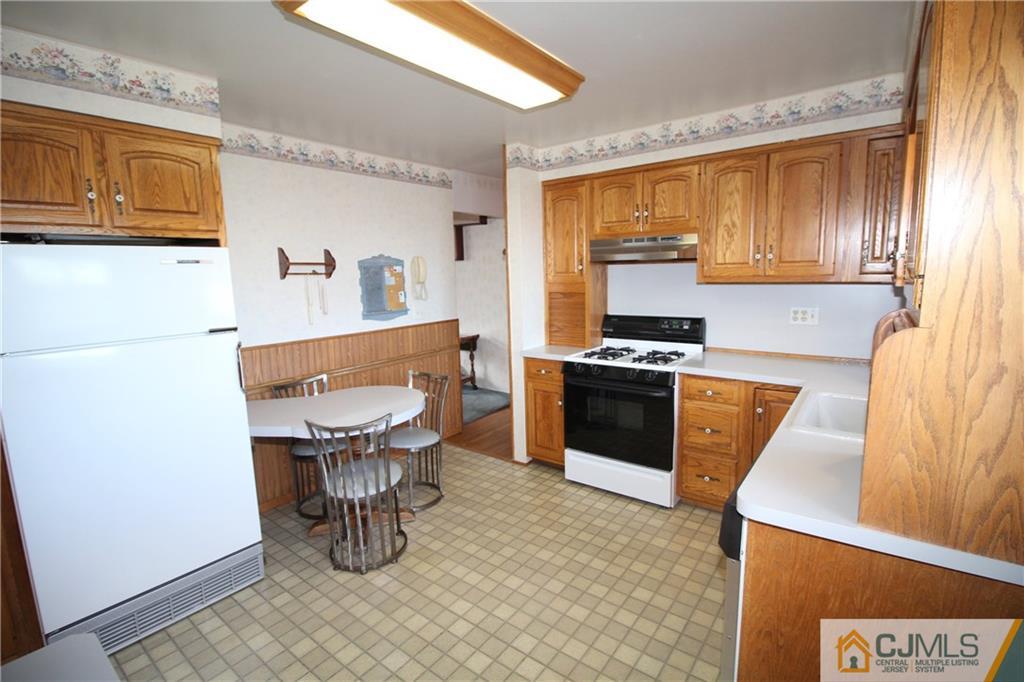 25 Montview Road Edison, NJ 08837 - Photo 2 of 21 a kitchen with a sink a stove and a refrigerator