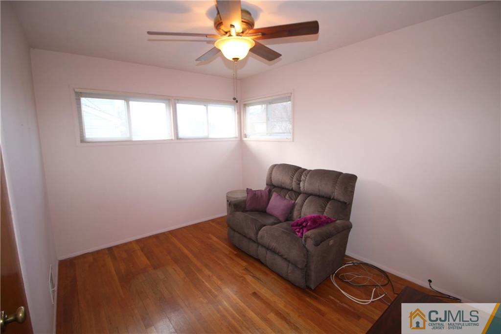 25 Montview Road Edison, NJ 08837 - Photo 12 of 21 a living room with furniture and a window