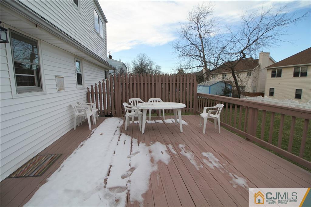 25 Montview Road Edison, NJ 08837 - Photo 20 of 21 a view of a roof deck with table and chairs and wooden floor