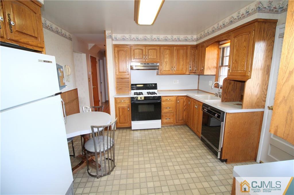 25 Montview Road Edison, NJ 08837 - Photo 3 of 21 a kitchen with a sink appliances and cabinets