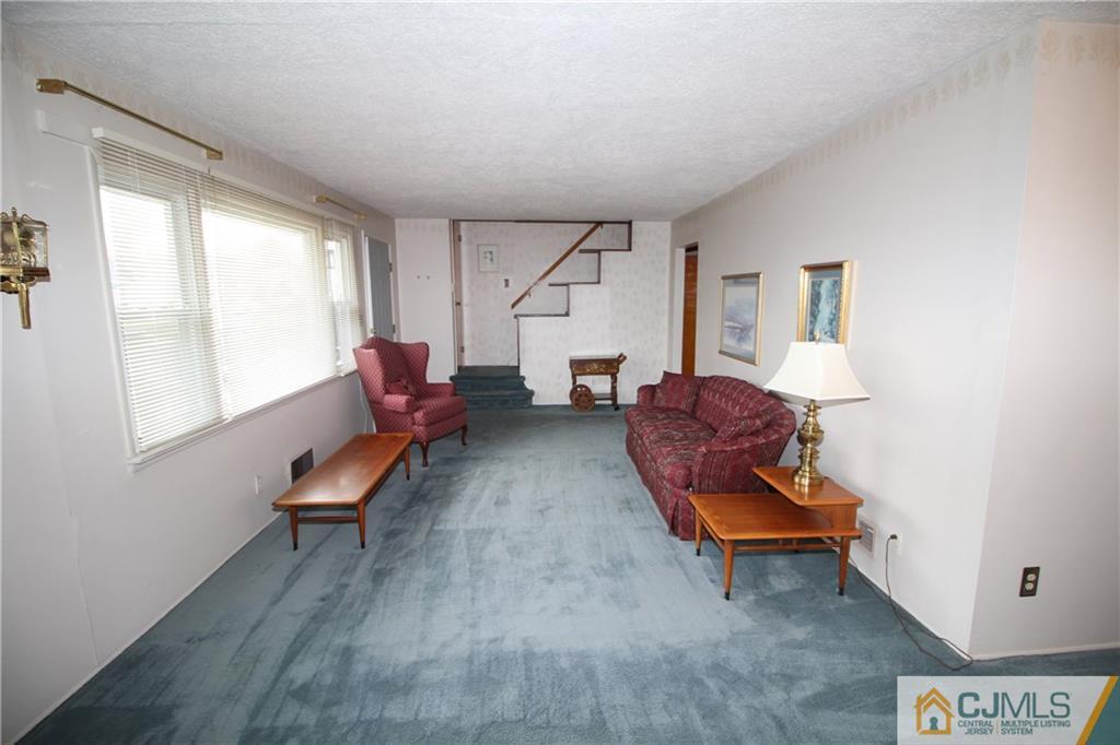 25 Montview Road Edison, NJ 08837 - Photo 7 of 21 a living room with furniture and a window